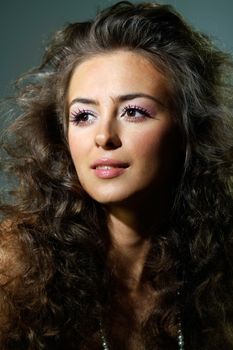 Beautiful young woman in gray background