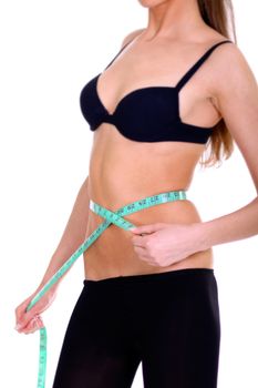 Fitness young woman in white isolated
