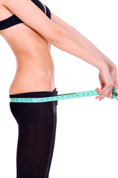 Fitness young woman in white isolated