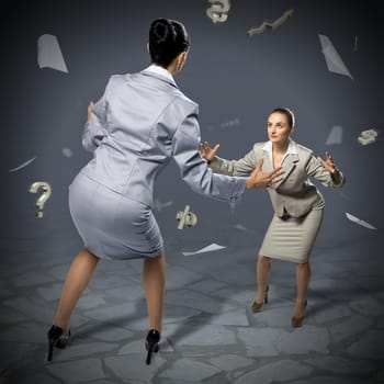 two businesswomen fighting as sumoists, the concept of competition in business