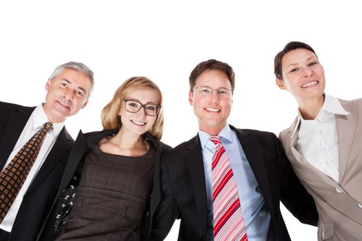 Low angle view of four diverse business executives looking down into the camera from above isolated on white