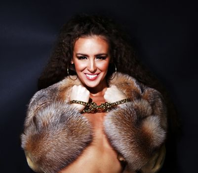 Sexual model in a fur coat