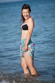 Beautiful young woman at the beach at Mediterranean Sea