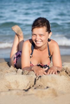 Portrait of beautiful young woman relaxing at the beach