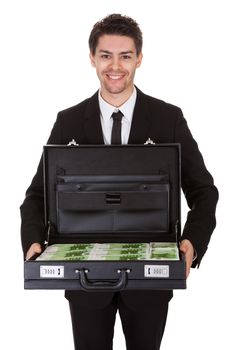 Businessman with suitcase full of cash. Isolated on white