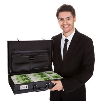 Businessman with suitcase full of cash. Isolated on white