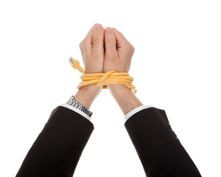 Businessman with hands tied in network cable. Isolated on white