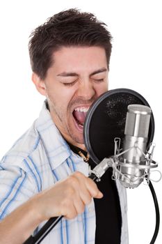 Young singer and microphone. Isolated on white