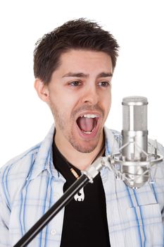 Young singer and microphone. Isolated on white