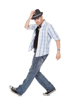 Young dancer touching his hat and one arm outstretched