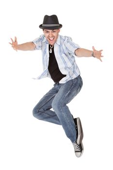 Young dancer in mid air jump with arms outstretched