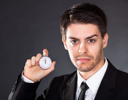 Business man holding stop watch in his hand