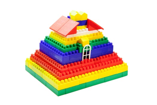 toy house out of colored blocks closeup on white background