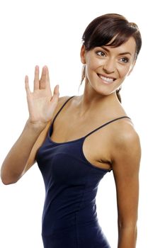 Young woman waving her hand to gesture hello