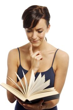 Young woman flicking through the pages of a book