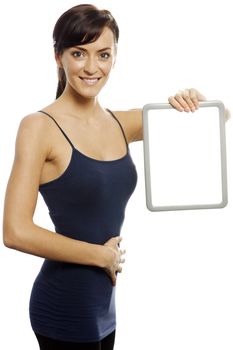 Young woman expressing weight loss holding a wipe board.