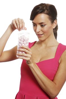 Young woman holding a sweet jar