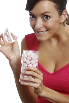 Young woman holding a sweet jar