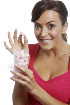 Young woman holding a sweet jar