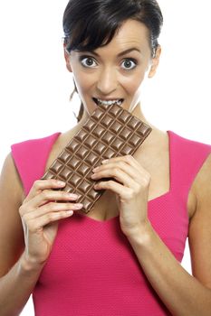 Young woman eating a huge chocolate bar