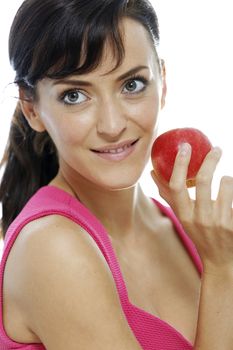 Young woman holding a fresh apple.