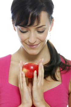 Young woman holding a fresh apple.