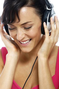 Young woman listening to music on her headphones.