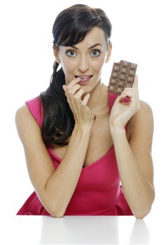 Woman eating a huge chocolate bar