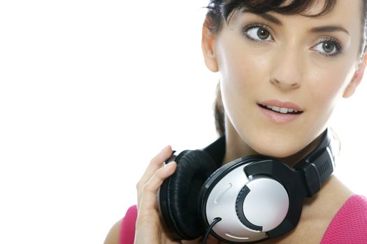 Young woman listening to music on her headphones.