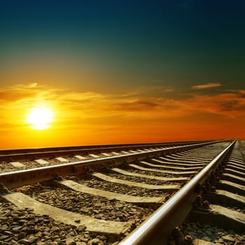 orange sunset over railroad