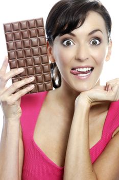 Young woman eating a huge chocolate bar