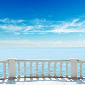 view to sea from terrace with balcony under cloudy sky