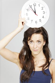 Woman expressing concept of time hanging over her.