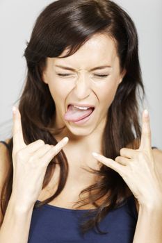 Young woman pulling a wacky face expression.