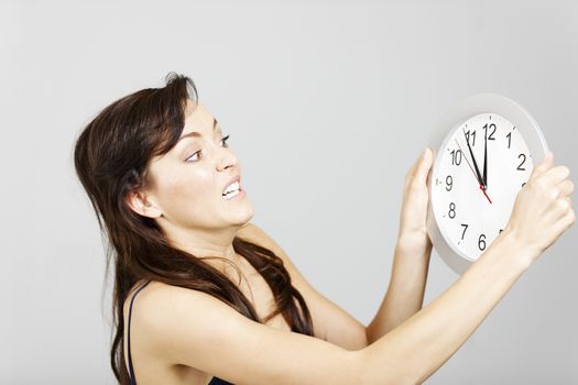 Woman with clock face looking concerned.