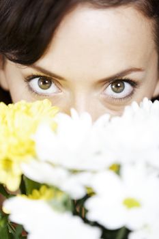 Woman smelling fresh flowers