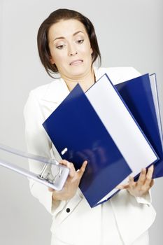 Business woman with too many folders