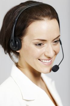 Happy call centre lady with telephone headset