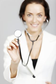 Helpful young doctor with stethoscope.