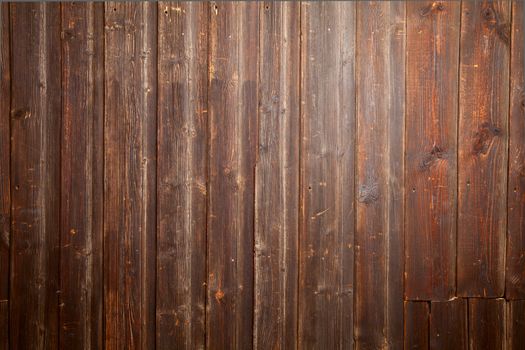 Wall decorated by old wooden planks
