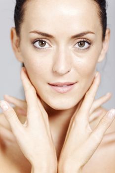 Young woman in a beauty style pose with natural skin.