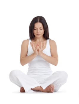 woman sitting on the floor exercising yoga - isolated on white