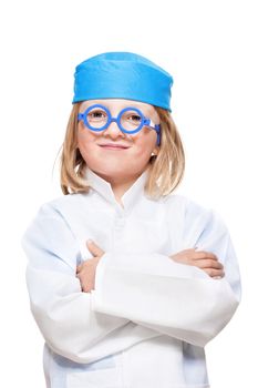 boy with long blond hair playing a doctor smiling