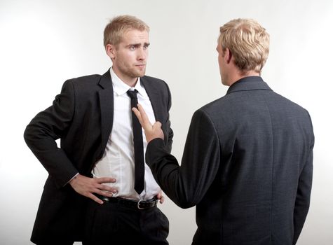 two you businessmen standing, discussing, arguing