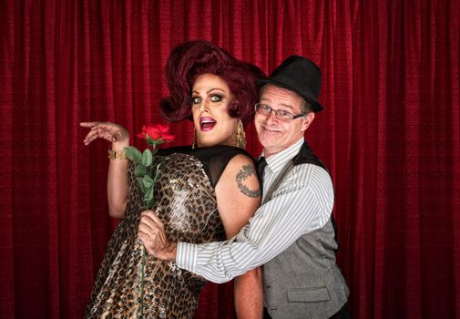 Man in hat attracted to drag queen