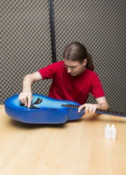 Guitarist cleaning his guitar with a cleaning towel ( Series with the same model available)