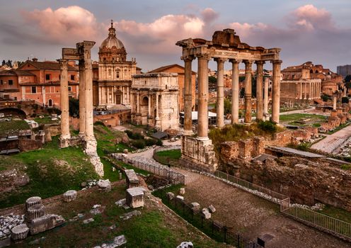 Roman Forum (Foro Romano) and Ruins of Septimius Severus Arch and Saturn Temple at Sunset, Rome, Italy