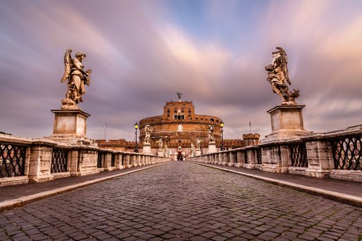 Castle of Holy Angel and Holy Angel Bridge over the Tiber River in Rome at Dawn, Italy