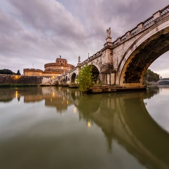 Castle of Holy Angel and Holy Angel Bridge over the Tiber River in Rome at Dawn, Italy