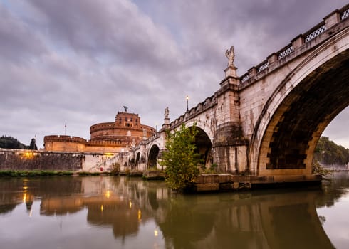 Castle of Holy Angel and Holy Angel Bridge over the Tiber River in Rome at Dawn, Italy